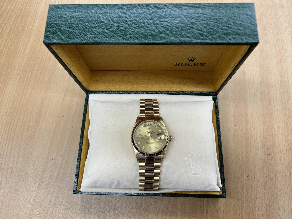 Rolex Oyster Perpetual Day Date with 10 Diamonds in 18K Yellow Gold and Champagne 18038A