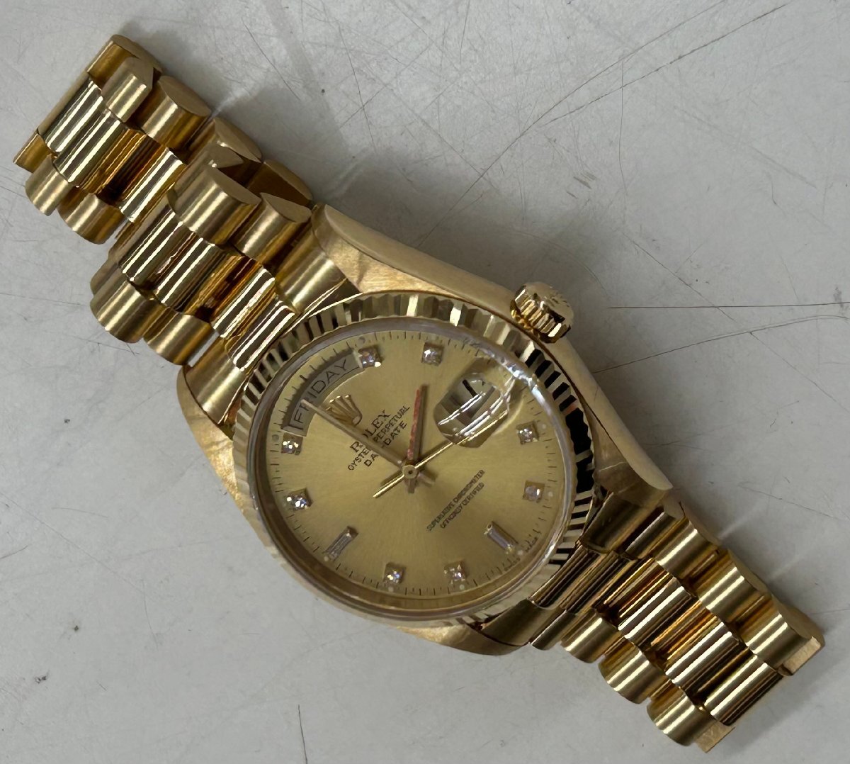 Rolex Oyster Perpetual Day Date with 10 Diamonds in 18K Yellow Gold and Champagne 18038A