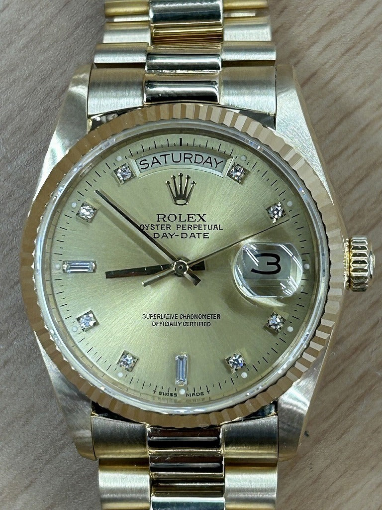 Rolex Oyster Perpetual Day Date with 10 Diamonds in 18K Yellow Gold and Champagne 18038A
